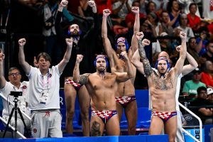 Athletes of team Croatia cheer during the water polo men semifinal match between team Hungary (white caps) and team Croatia (blue caps) of the Paris 2024 Olympic Games at La Defense Arena in Paris (France), August 09, 2024.