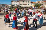 Tourists enjoy old traditions in Croatian fishing village of Betina