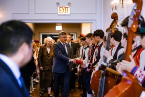 Croatian Prime Minister Andrej Plenković and Croatian Consul General of Chicago Sanja Laković greeting students from Hrvatska Loza as they enter the center.