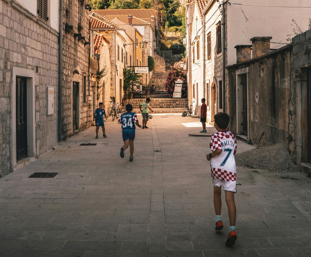 kids playing football croatia streets